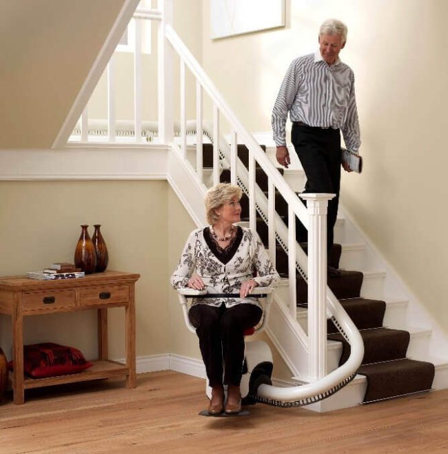 Elder Women Seating on Flow2 Indoor Stairlift