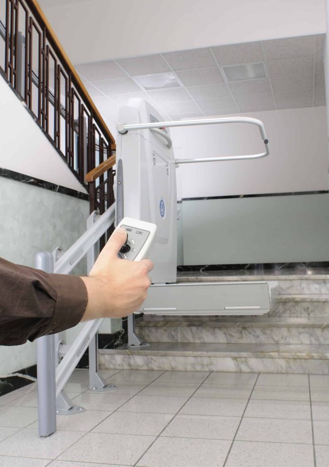 Home accessibility with Aussie Glide - A happy and satisfied customer utilizing a stairlift, highlighting the joy and ease of movement that our products bring to everyday life.